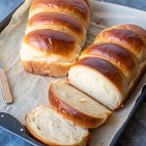 Sweetened Condensed Milk Bread with golden crust and soft texture on wooden board